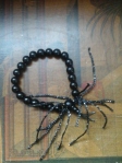 bracciale perle nere e filo lurex 5 euro