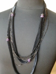 collana in ciniglia nera con filo lurex, perline nere e cristalli neri e viola 15 euro